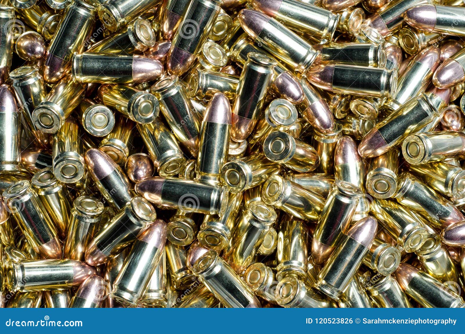 background of 9mm bullets jumbled together