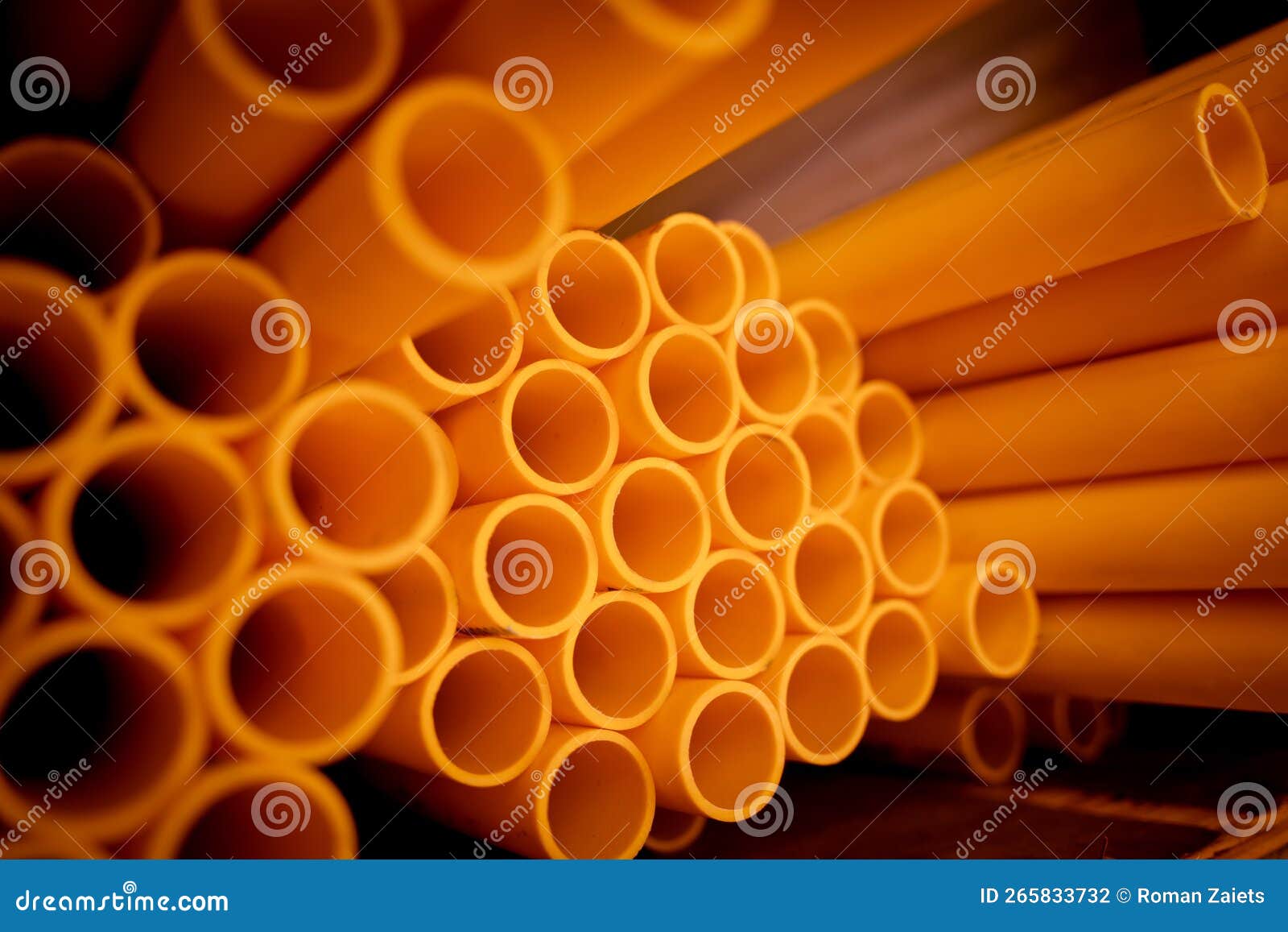 Background of the Orange Plastic Pipes in Stacked Stock Photo Image