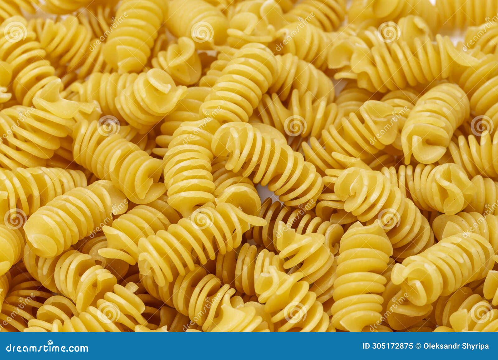 background from pasta. fusilli spirale texture