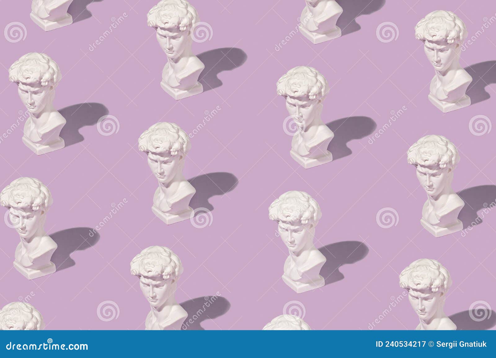background pattern of white grecian or roman busts