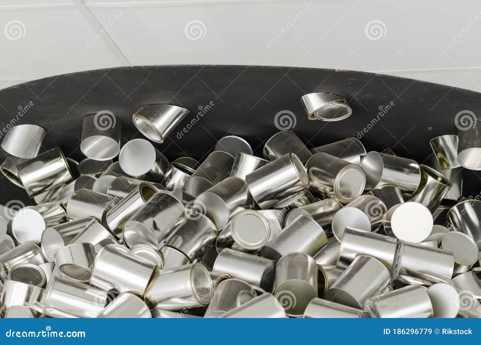 background with a pile of aluminum cans, steel, tin ...