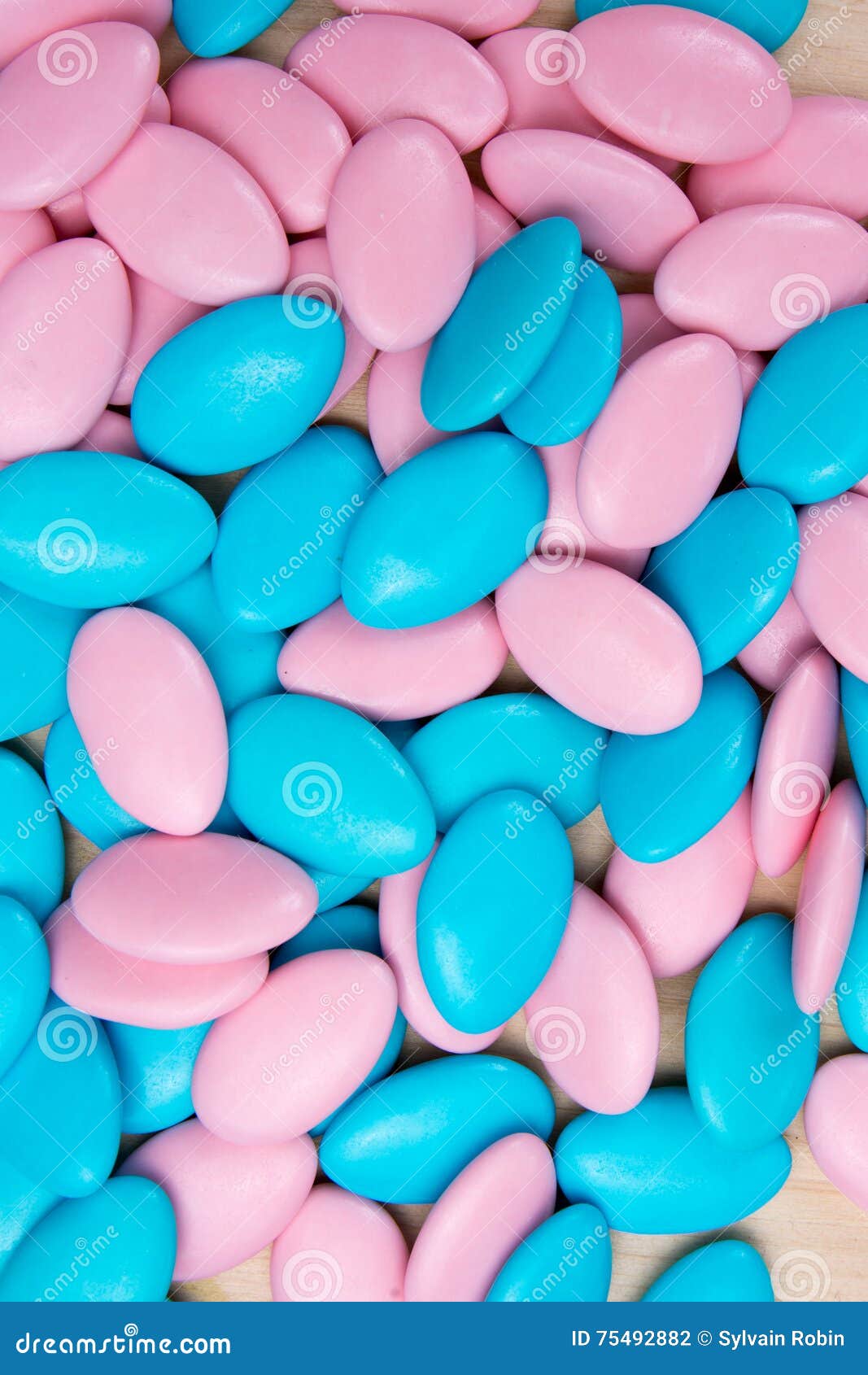 Background of Pink and Blue Sugared Almonds or Chocolate Stock Photo