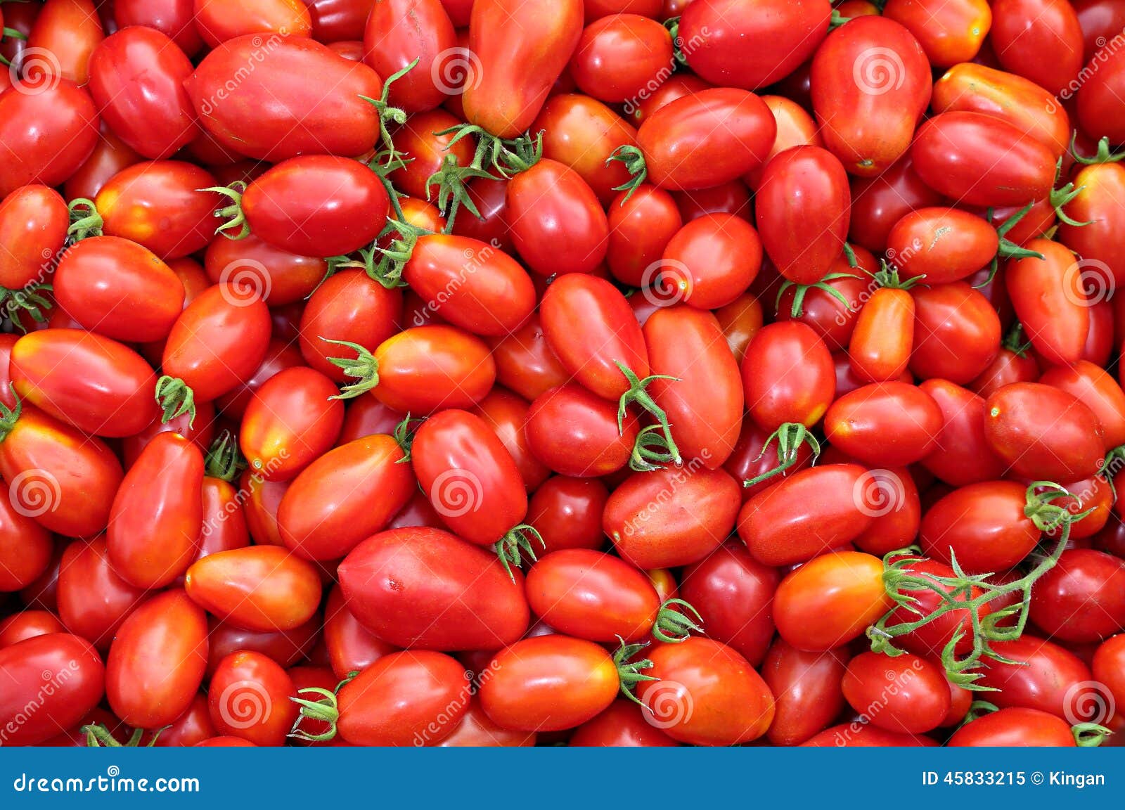 background of the plurality of red tomatoes