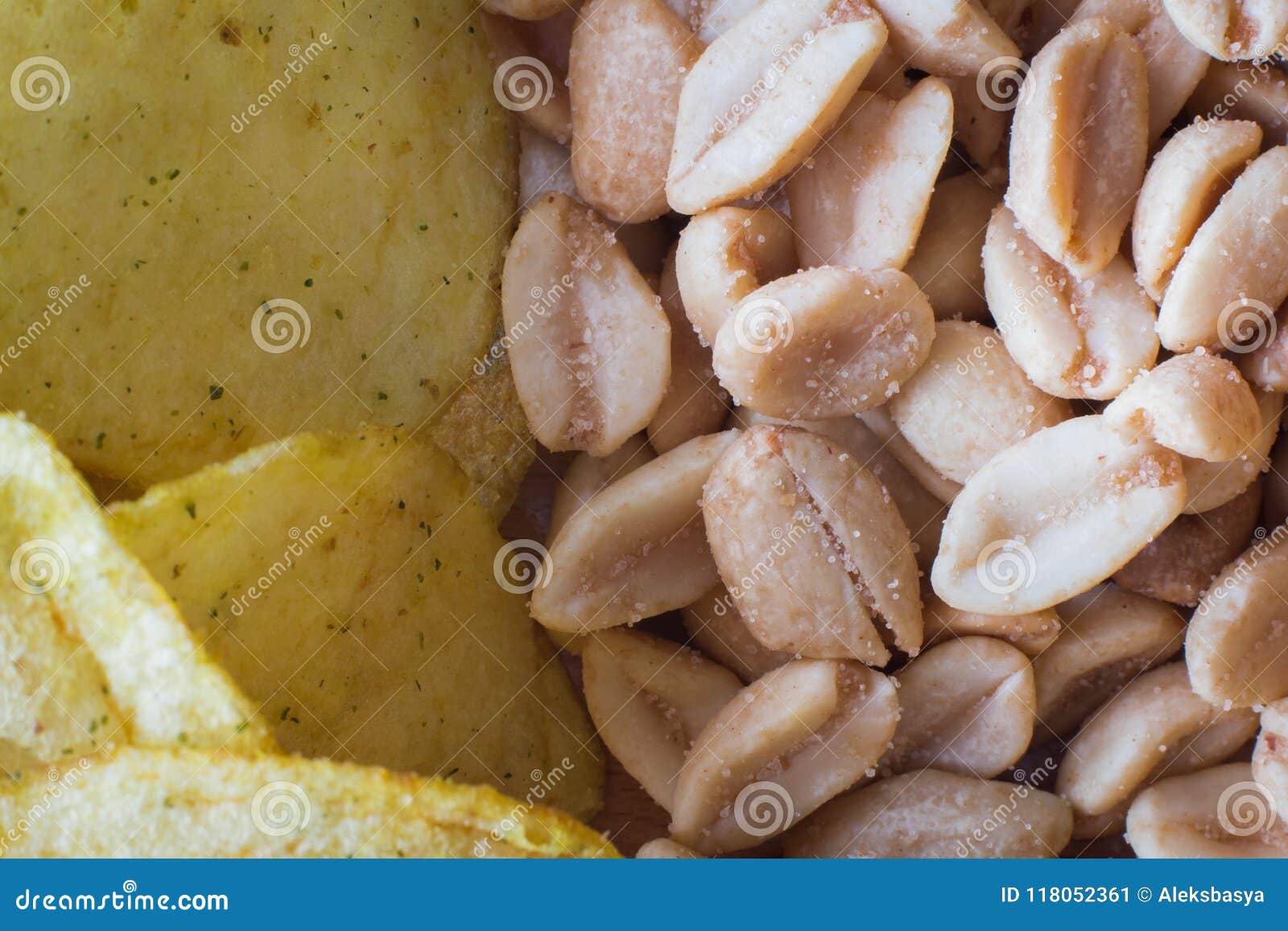 Background of Potato Chips and Roasted Peanuts. Background Stock Image