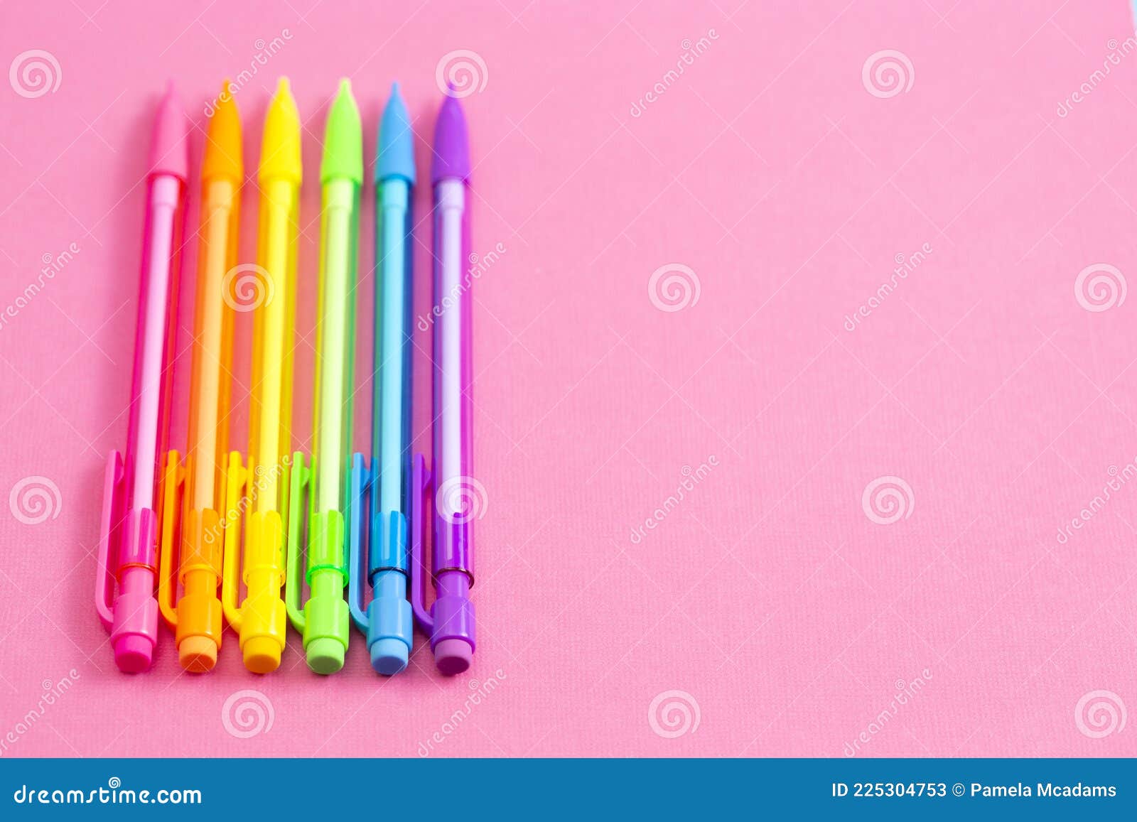 Background with Rainbow Mechanical Pencils on a Bright Pink Table Great ...
