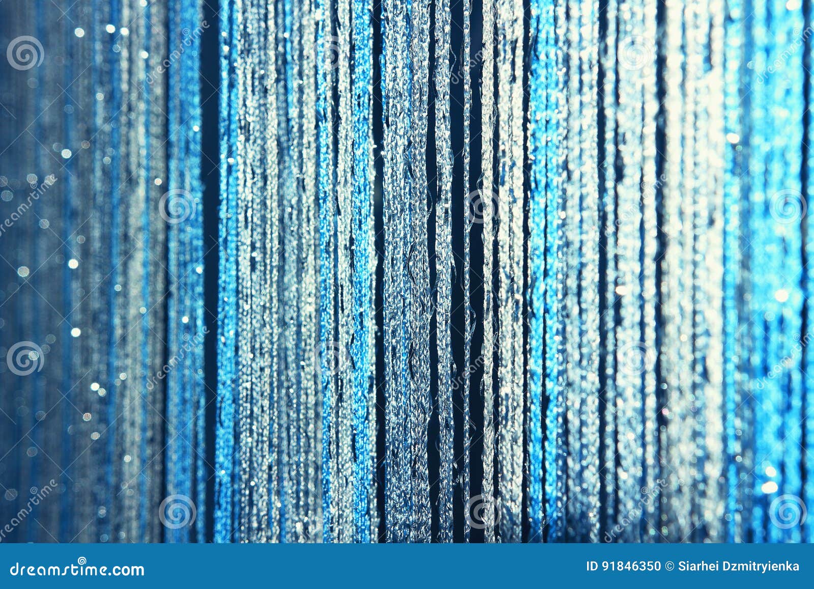 Background Texture Curtains Made of Blue Threads with Glitter and