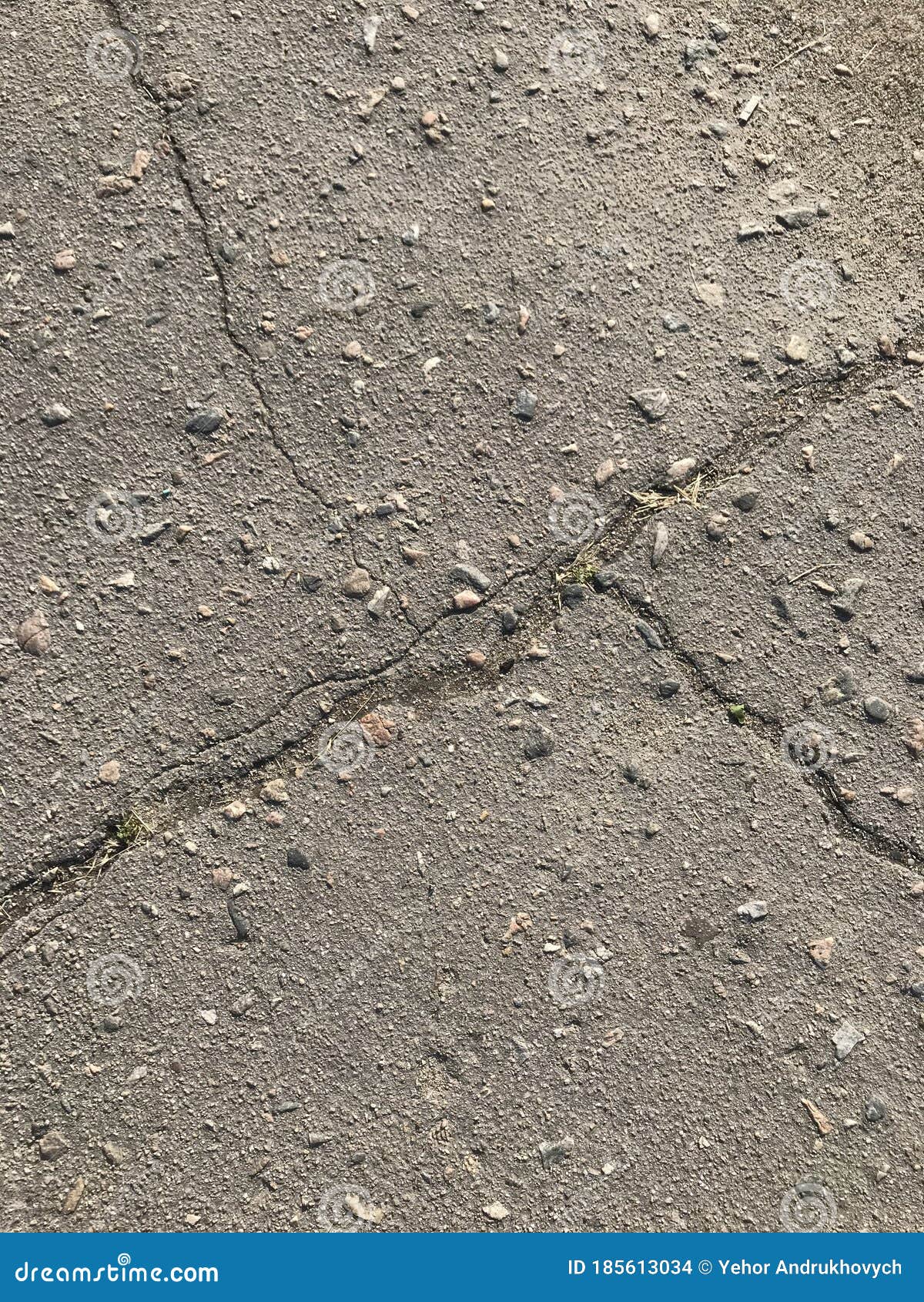 background texture pattern on an old road made of asphalt with trebles and granite rubble