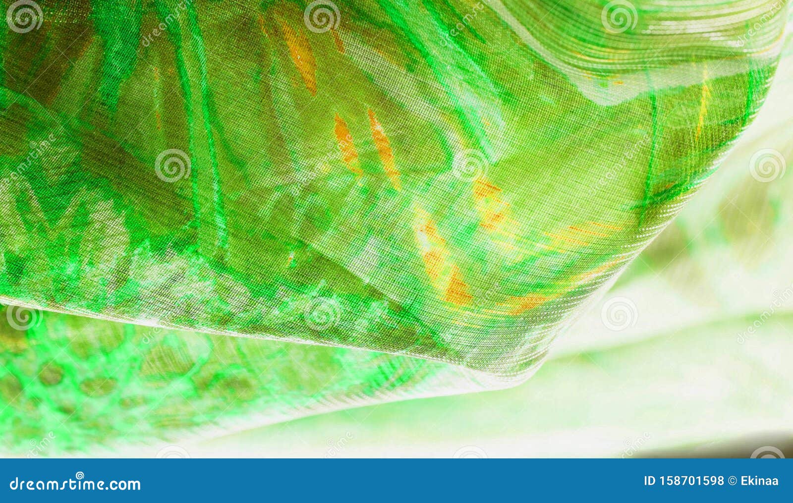 background texture, pattern. silk from a greenish emerald shade. this luxurious silk chiffon fabric is a show-stopper. it is clean