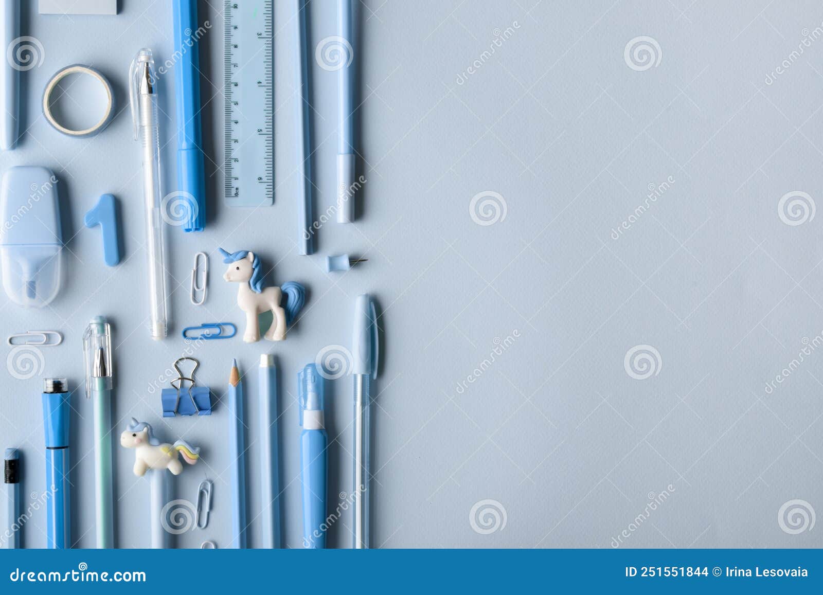 Background with Various Light Blue Stationery Lying on the Side on a