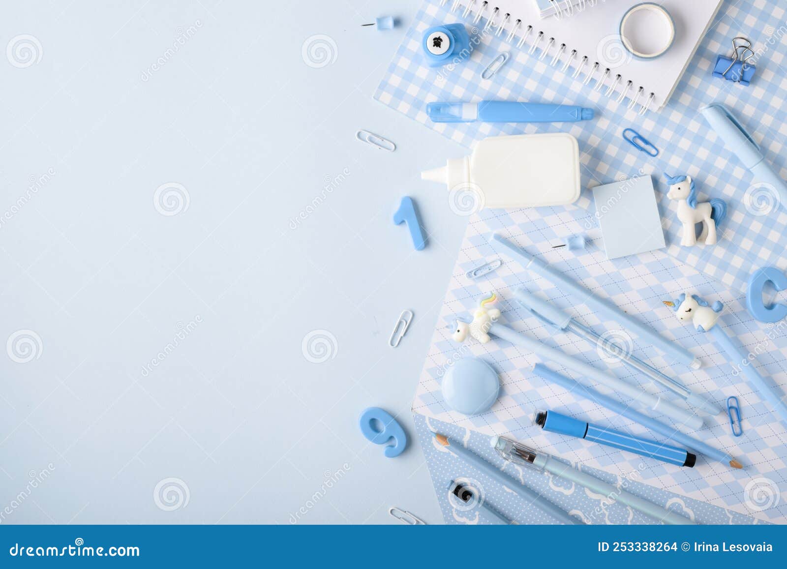 Background with Various Light Blue Stationery Lying on the Side on a