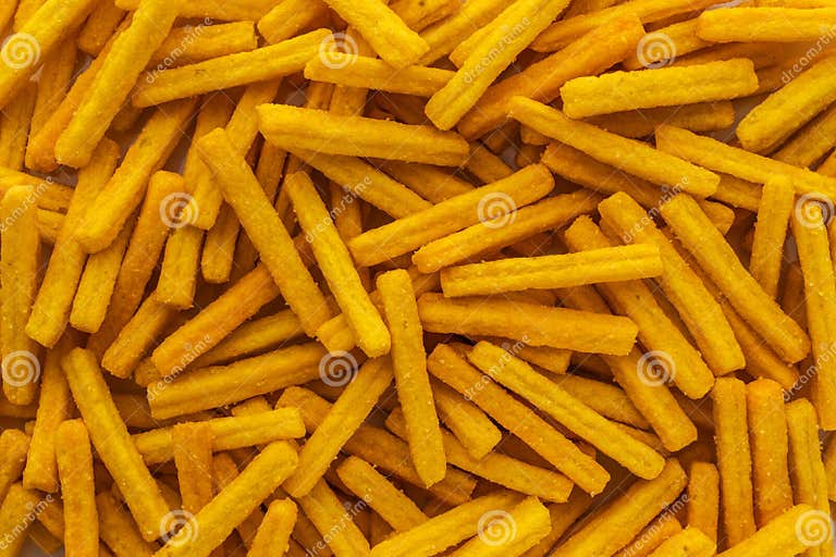 Background of Wheat and Corn Chips with a Taste of Cheese in the Form