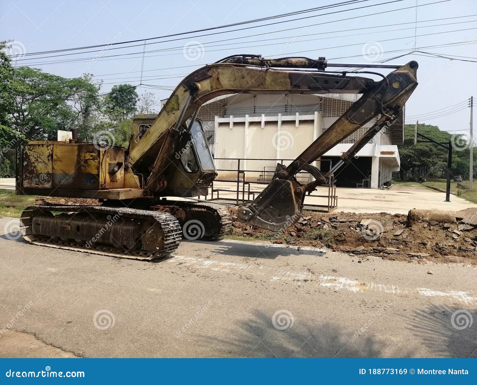 Backhoe is an Excavator Whose Shovel Bucket is Attached To a Hinged