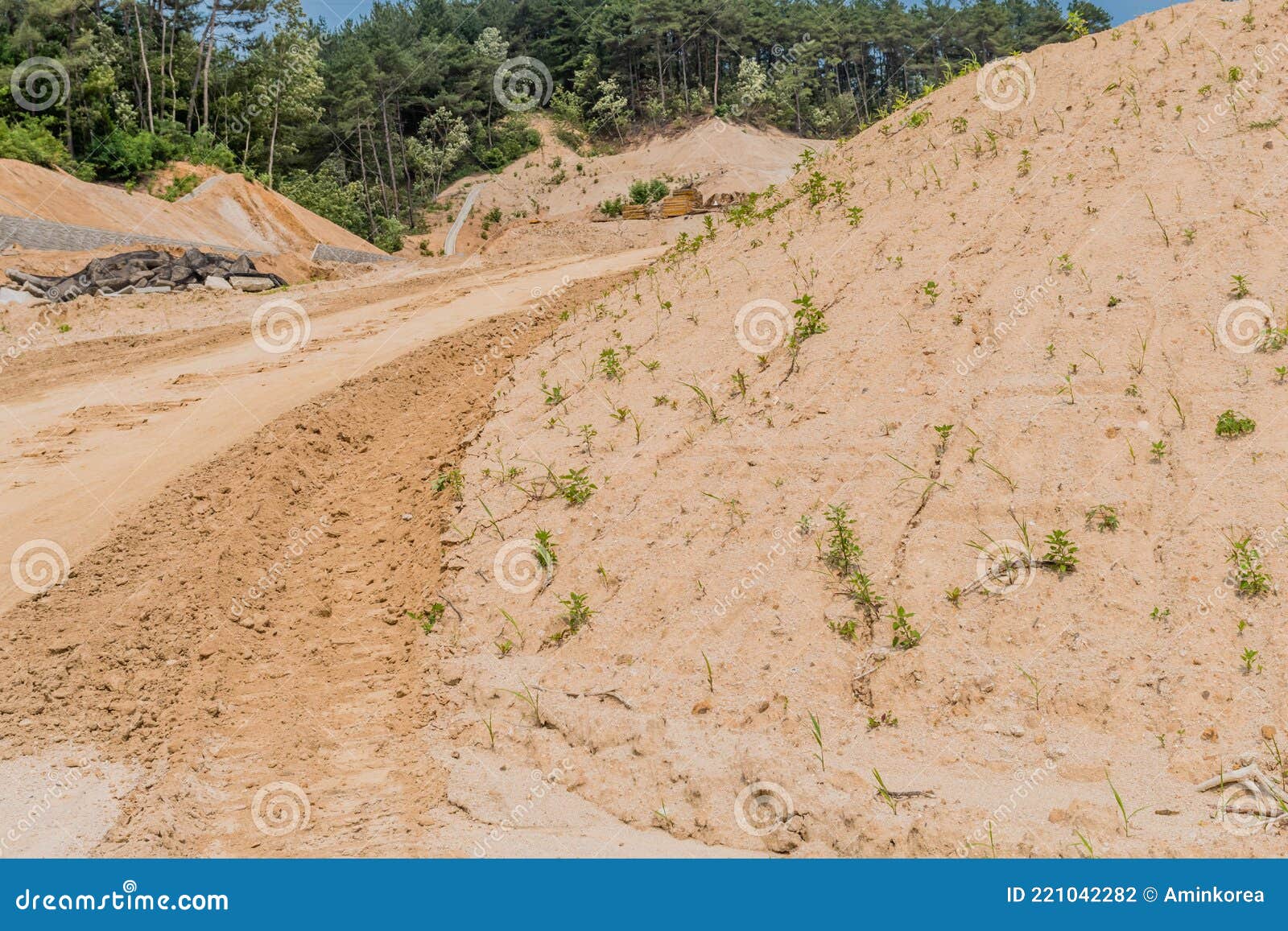 Backhoe tracks in red dirt stock photo. Image of clumps 221042282