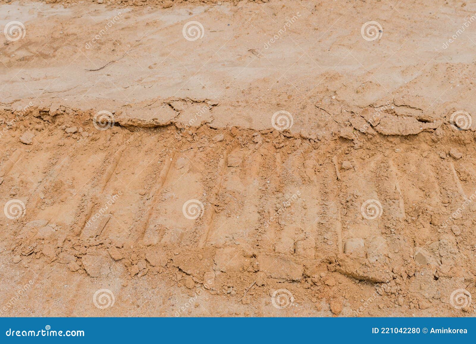 Backhoe tracks in red dirt stock photo. Image of korea 221042280