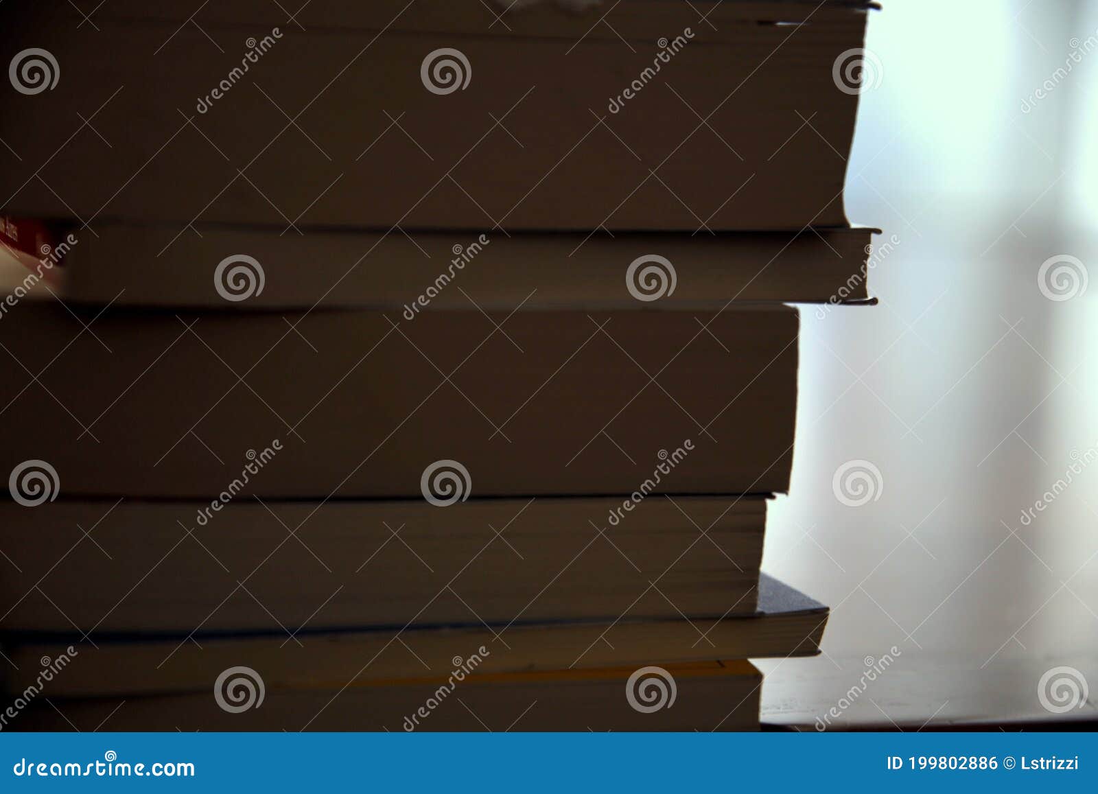 a backlighted stack of books
