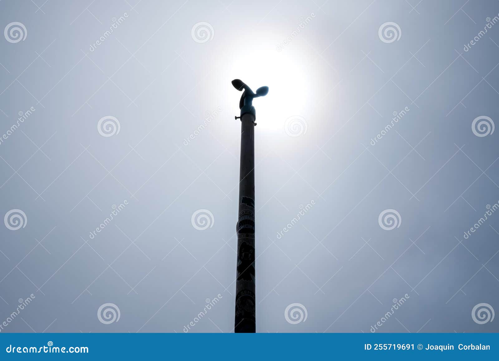 Backlit Anemometer on a Pole Against the Blue Sky Stock Image Image