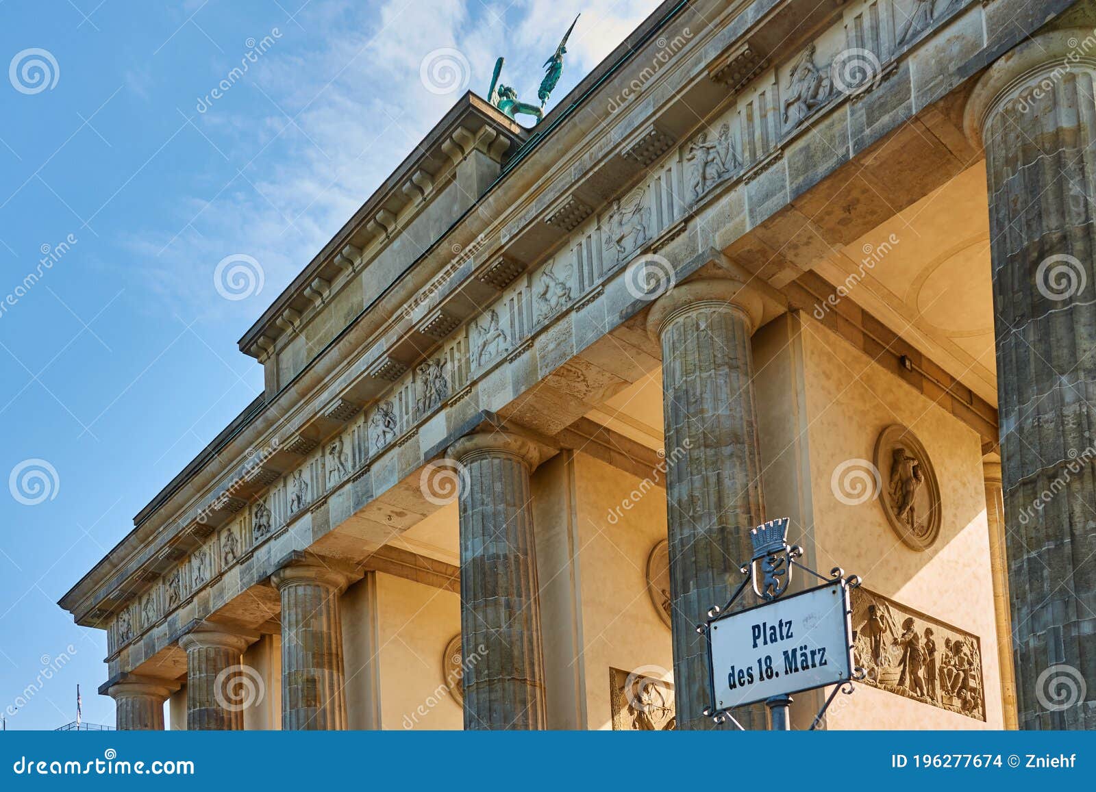 Backlit View of the Brandenburg Gate with a Sign with the German