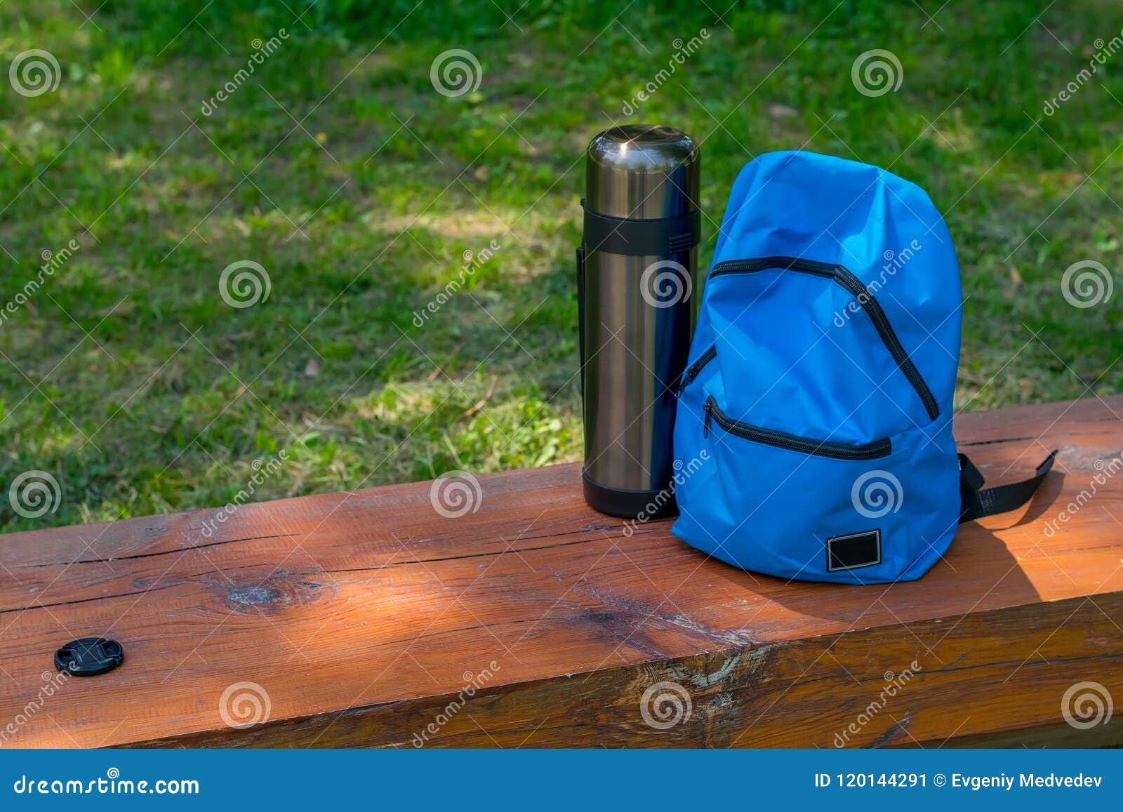 Backpack and Thermos for Camping on a Wooden Bench Stock Image - Image ...