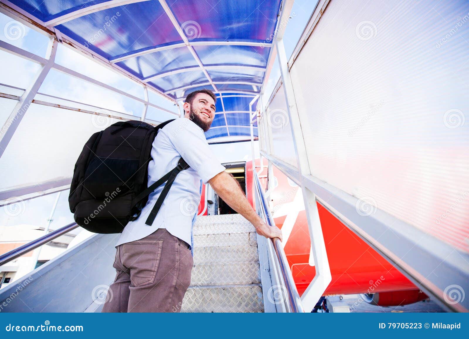 Backpacker Boarding the Airplane Stock Image Image of economy