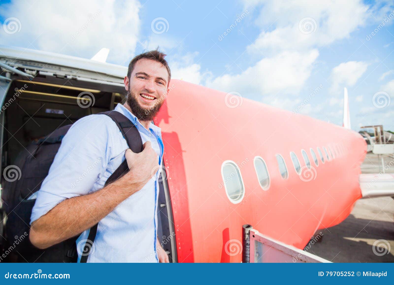 Backpacker Boarding the Airplane Stock Photo Image of handbag