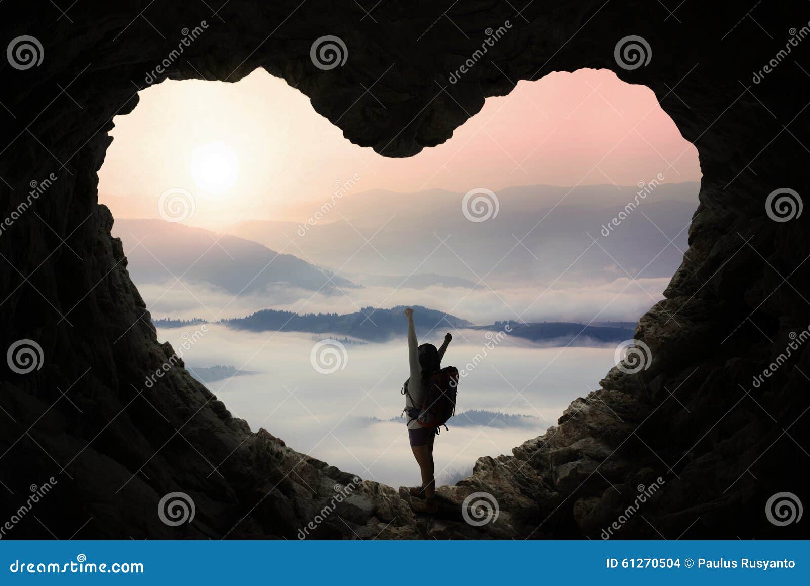 backpacker in cave enjoy mountain view
