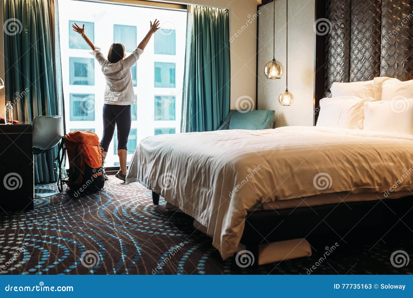 backpacker traveller happy to stay hotel