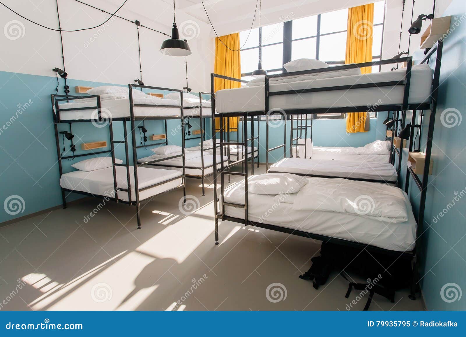 backpackers hostel with modern bunk beds in dorm room for twelve people