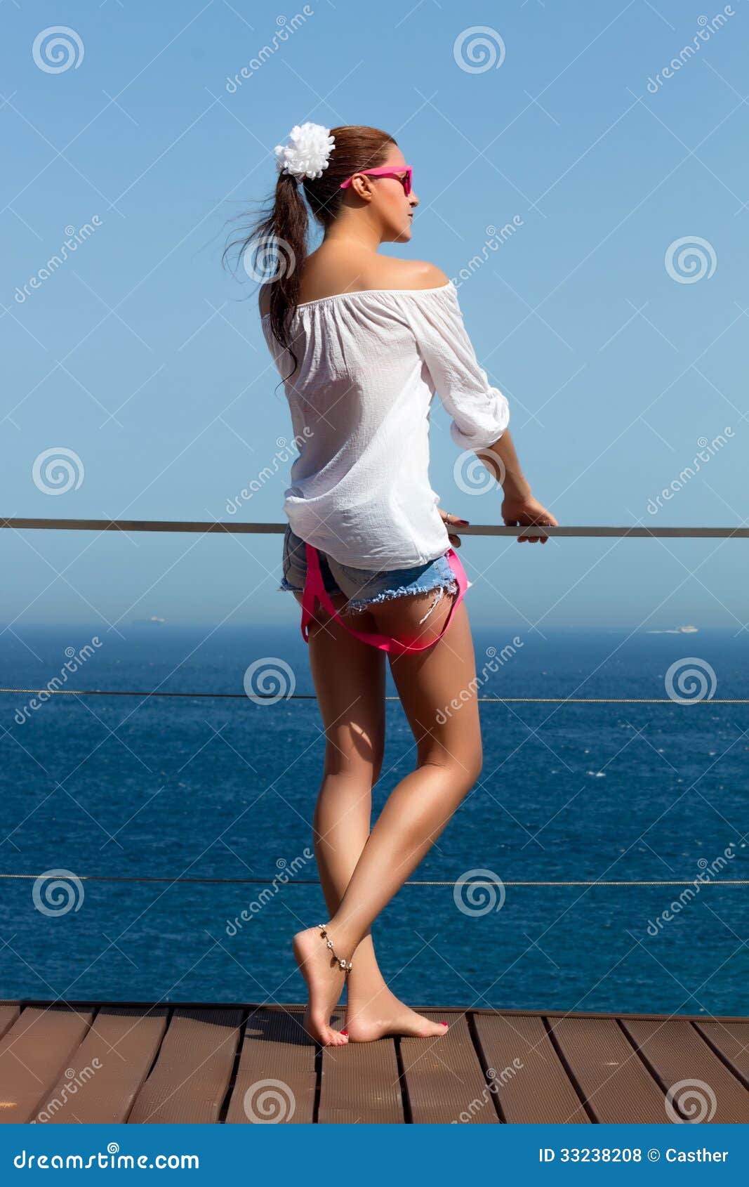 Backside Of Fashionable Girl In Denim Shorts. Beauty Legs Royalty Free