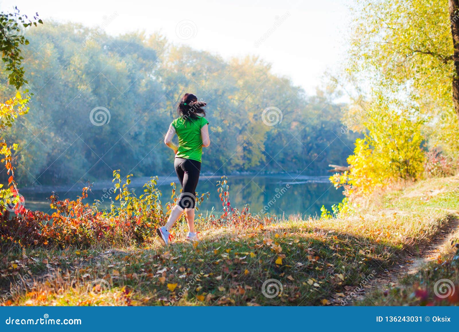 Backview of Woman in Motion Near the Forest River Stock Image - Image ...