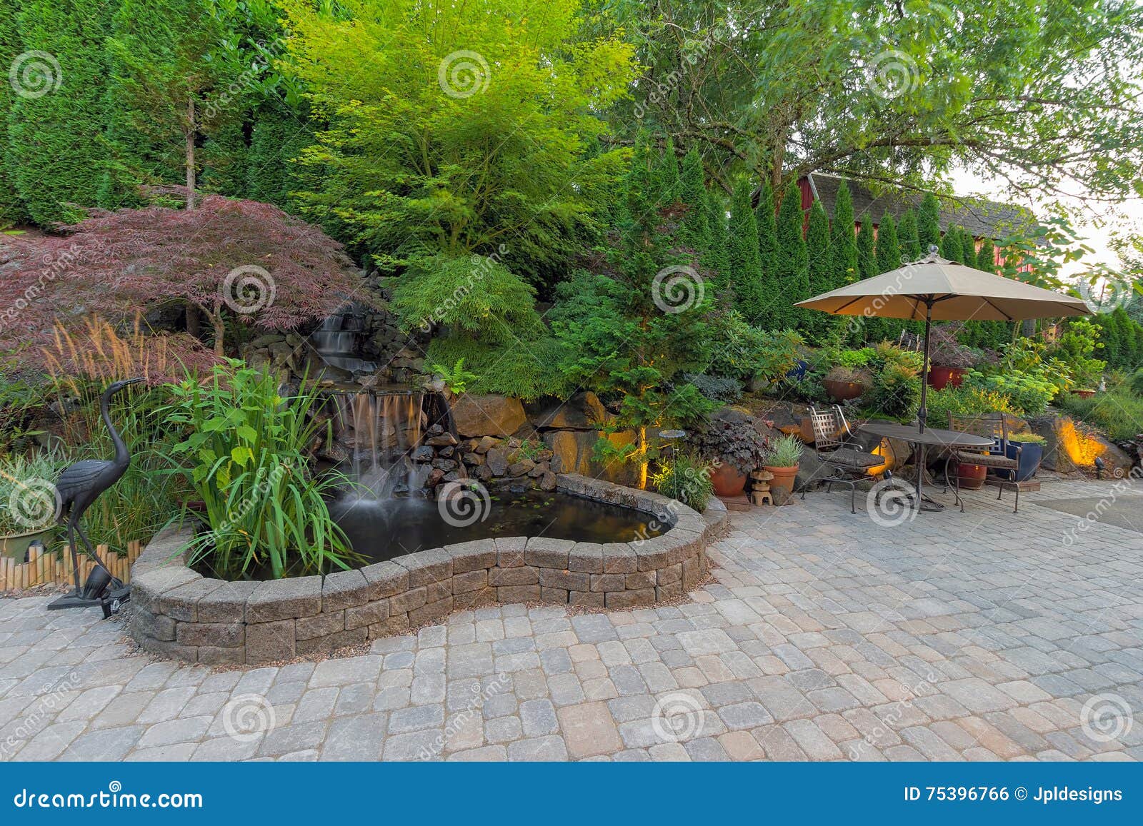 backyard landscaping patio with waterfall pond