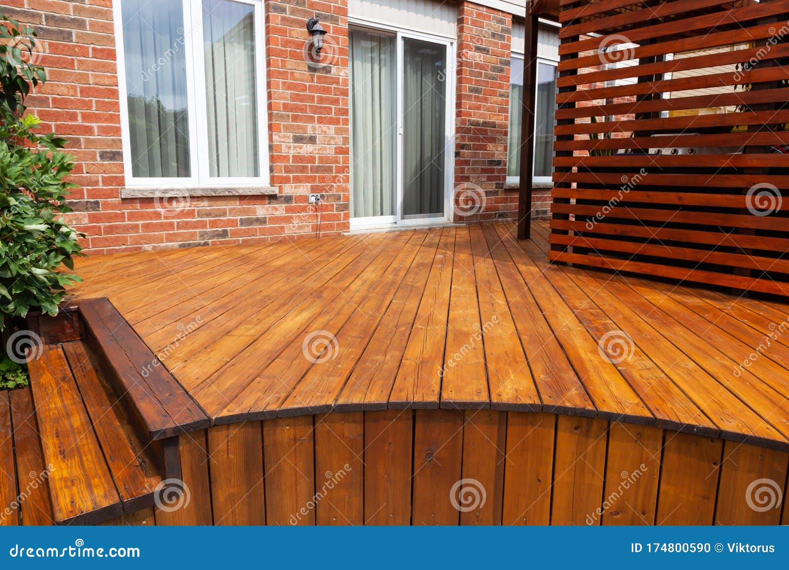 backyard wooden deck floor boards with fresh brown stain