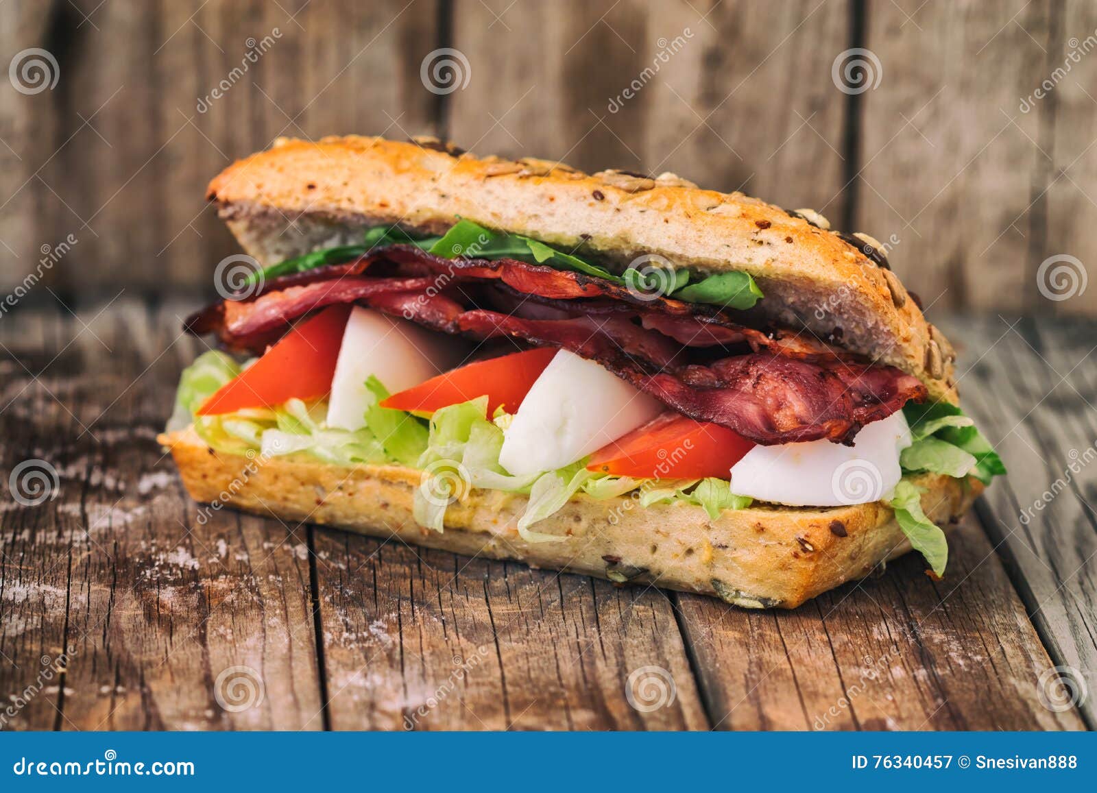 Bacon Baguette with Egg, Tomato and Lettuce. on an Old Wooden Table. Stock Image Image of