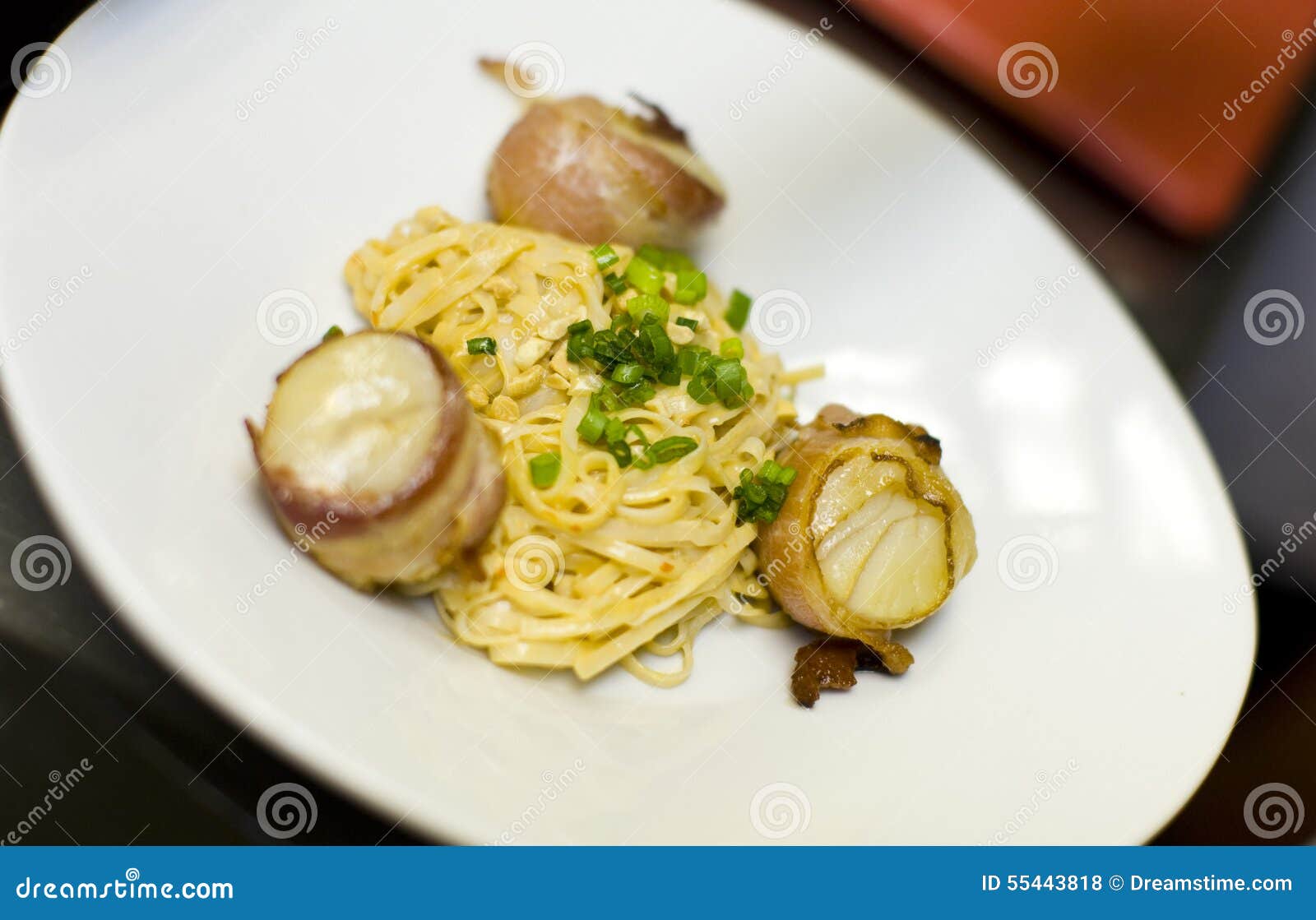 Bacon Wrapped Scallops and Fettuccine Stock Photo Image of green