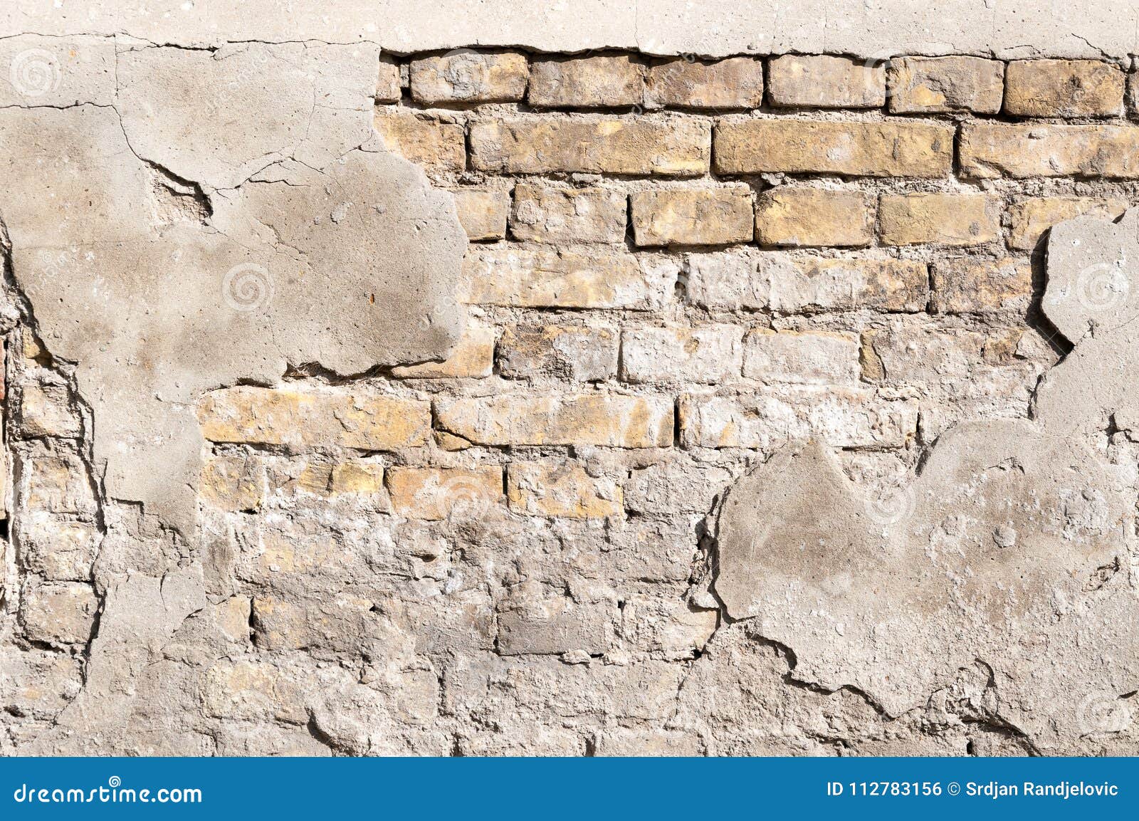 Bad Foundation Base on Old House or Building Cracked Plaster Facade Wall with Brick Background