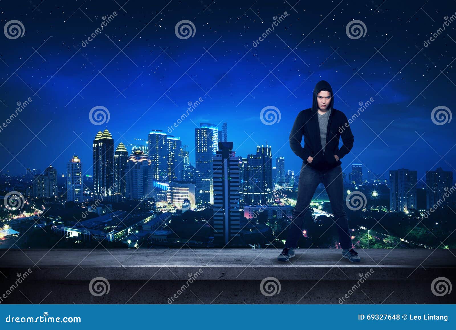 bad guy standing on the building rooftop