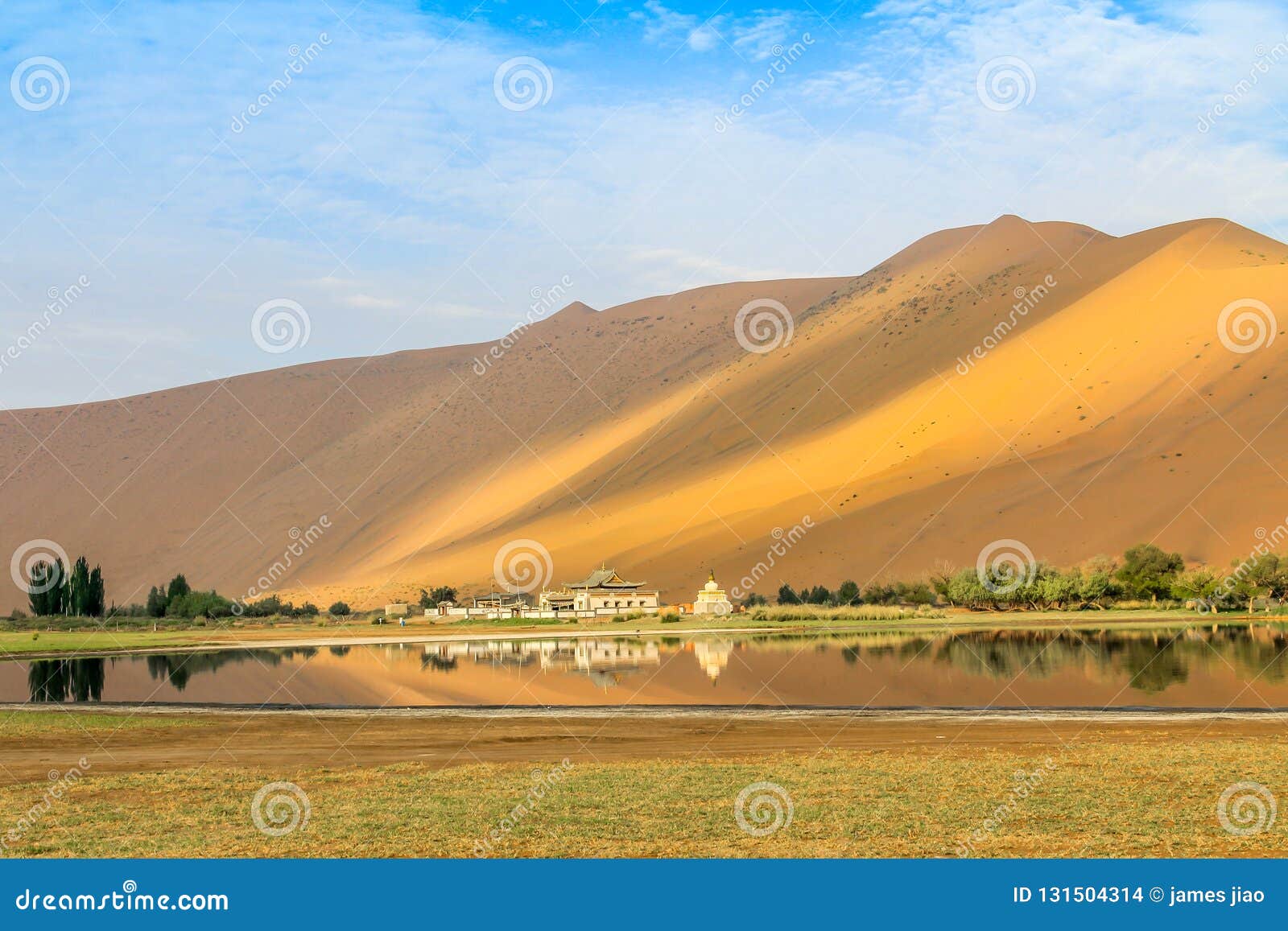 badain jaran desert with a temple and lake