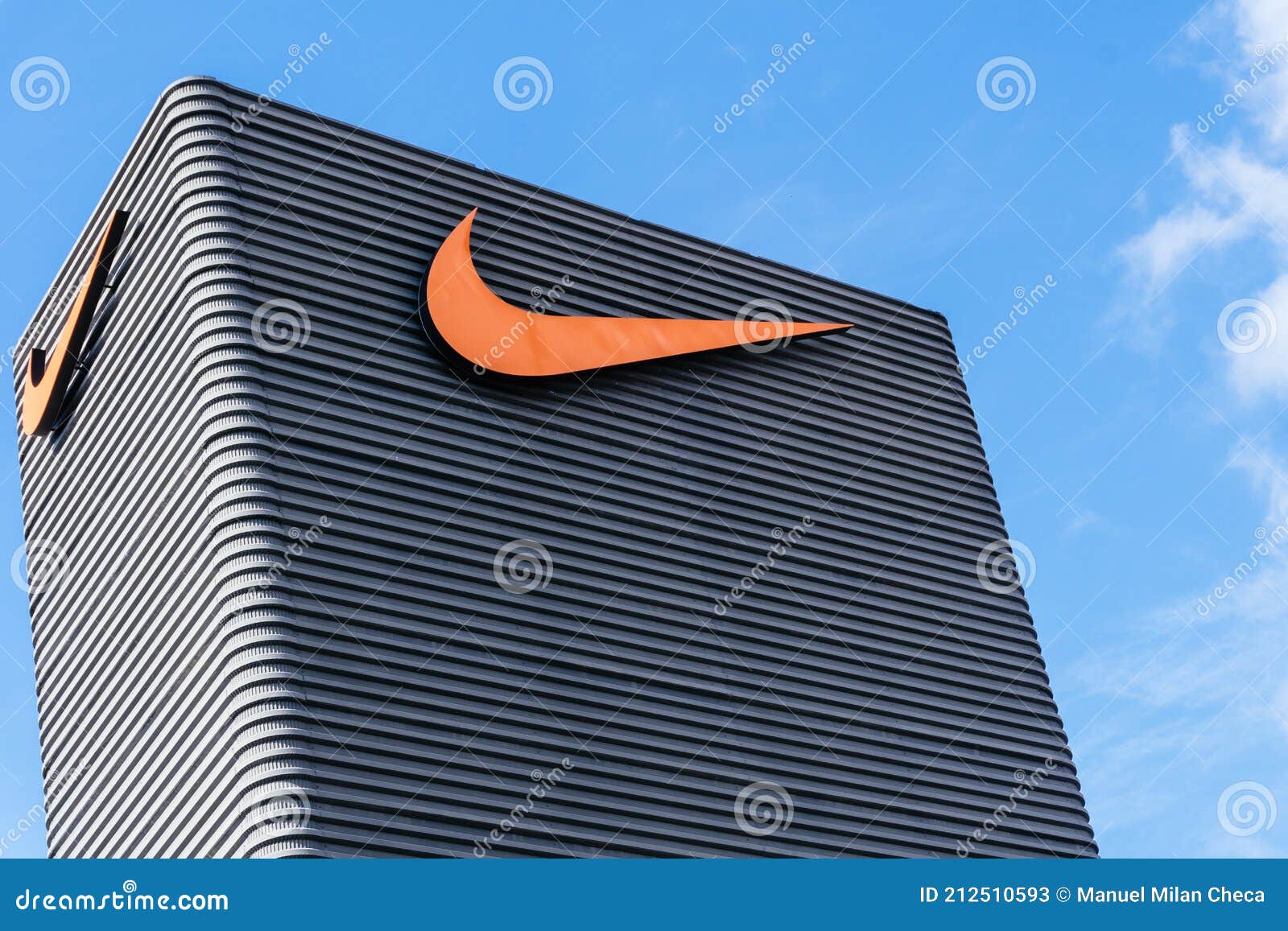 Badalona, Barcelona, Spain - February 28, 2021. Sign on the Facade of an American Multinational Company Dedicated To the Editorial Stock Photo - of sportswear, nike: 212510593