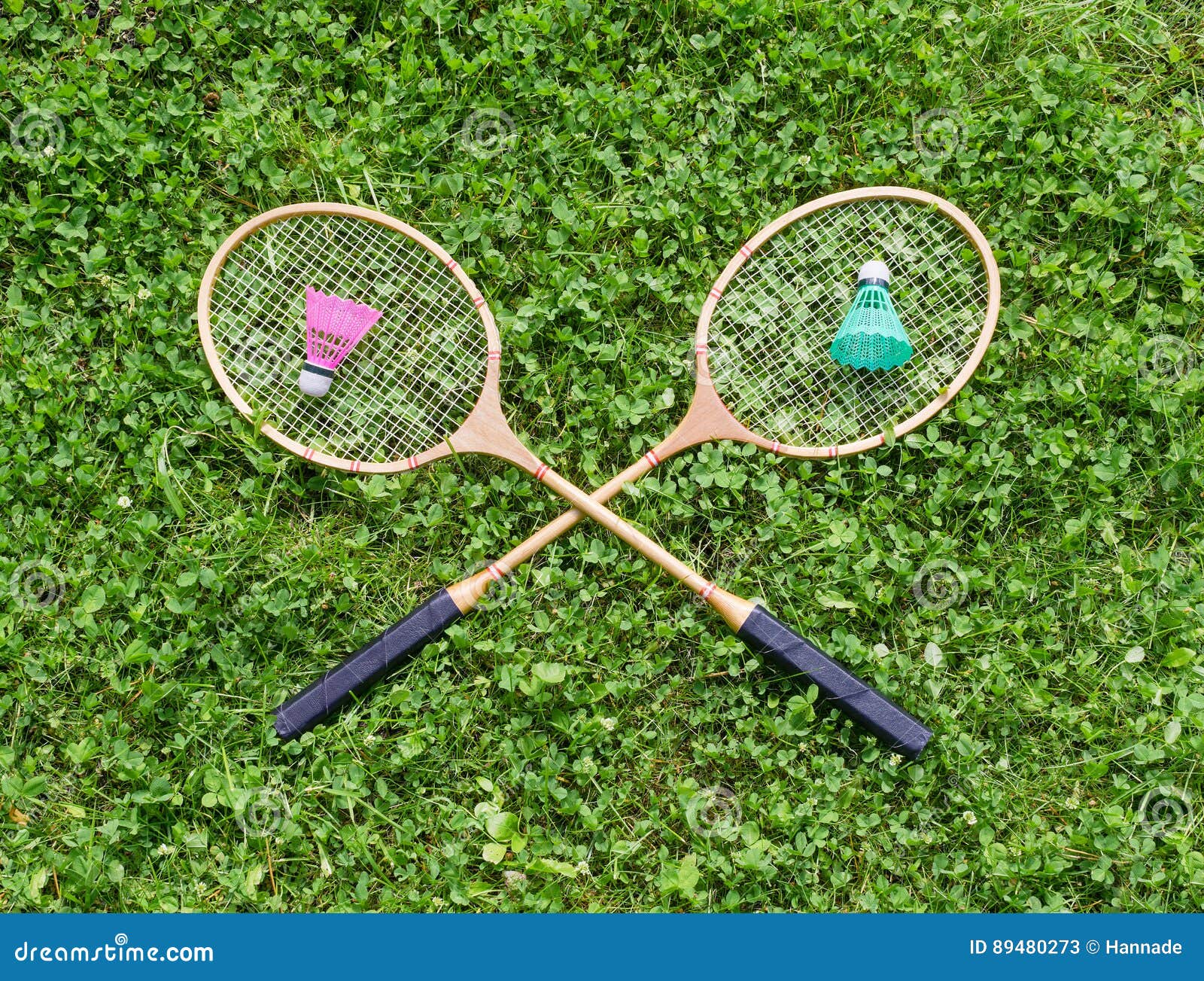 Badminton Rackets and Shuttlecocks on Grass Stock Image Image of