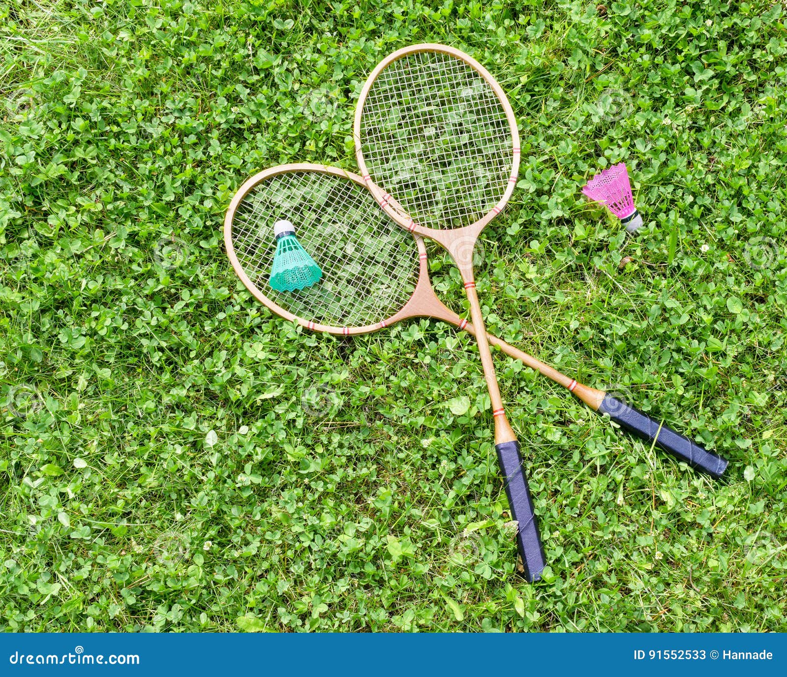 Badminton Rackets and Shuttlecocks on Grass Stock Image Image of