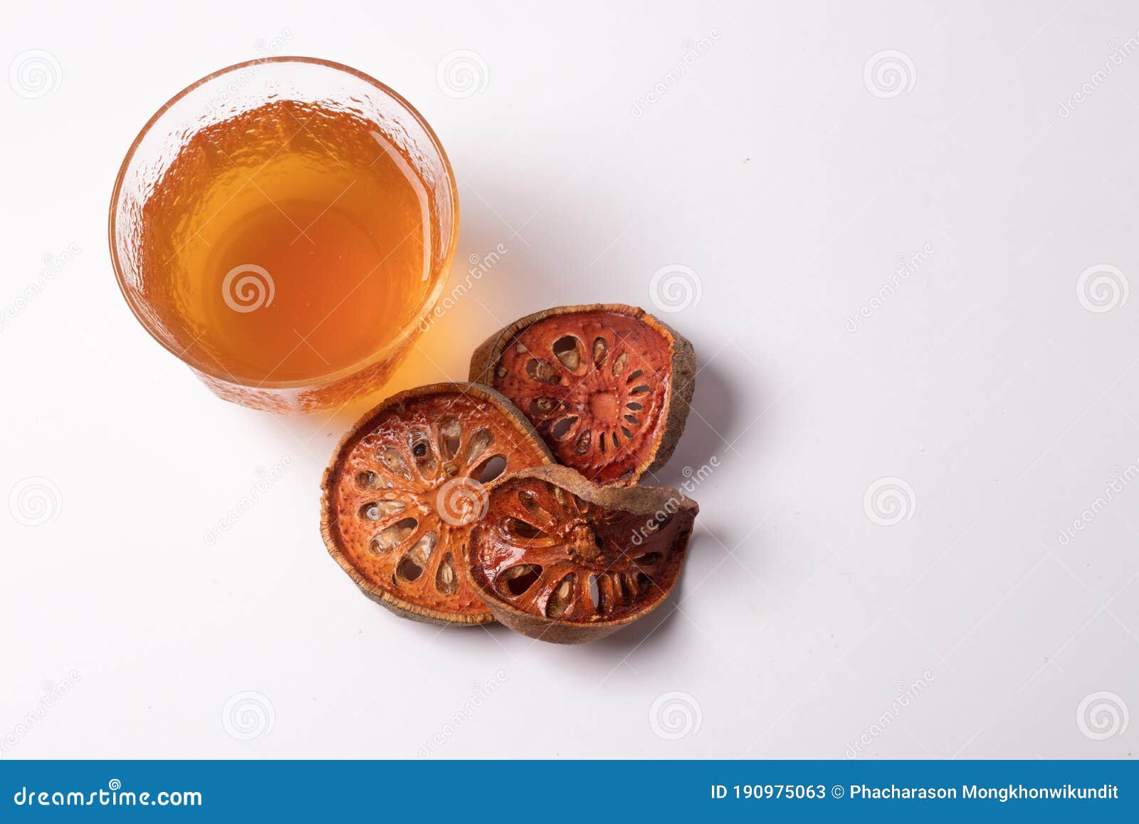 Bael Fruit Juice and Dried Quince on a White Background Stock Image