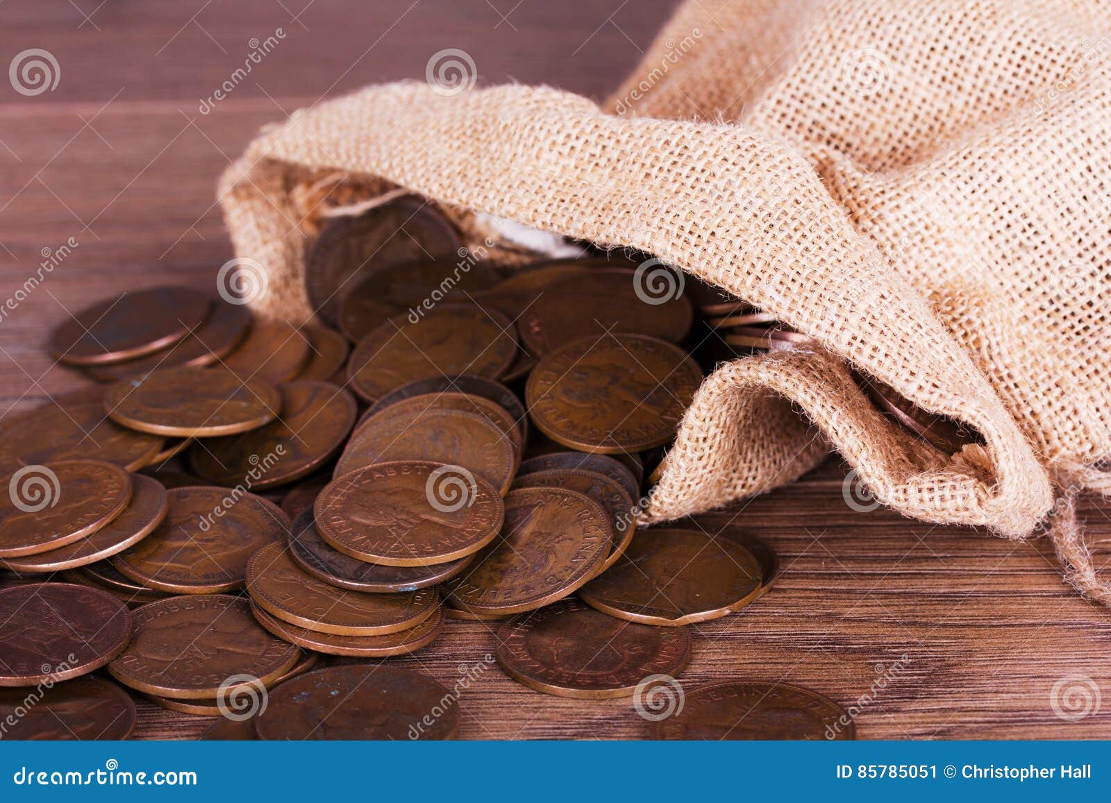 Bag of Coins Spilt Over a Wooden Surface Stock Image Image of savings