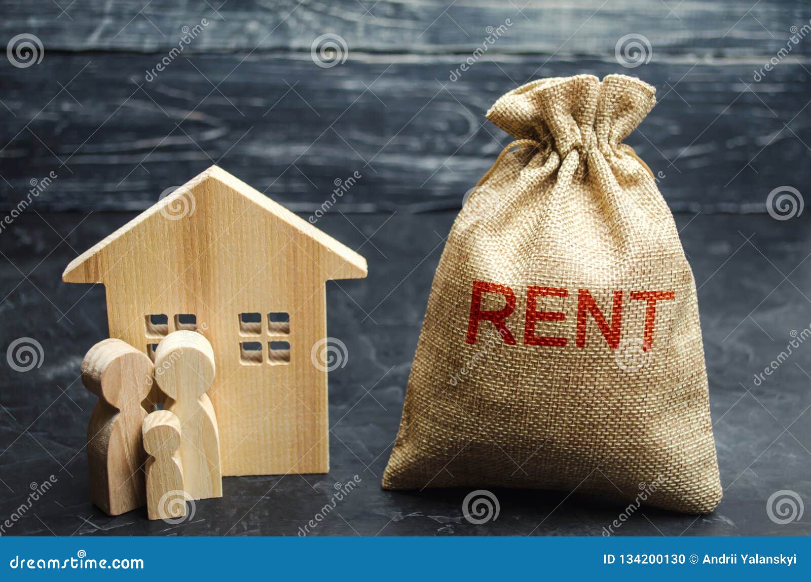 A Bag With Money And The Inscription Rent And The Family Is Standing Near The House. Removable ...