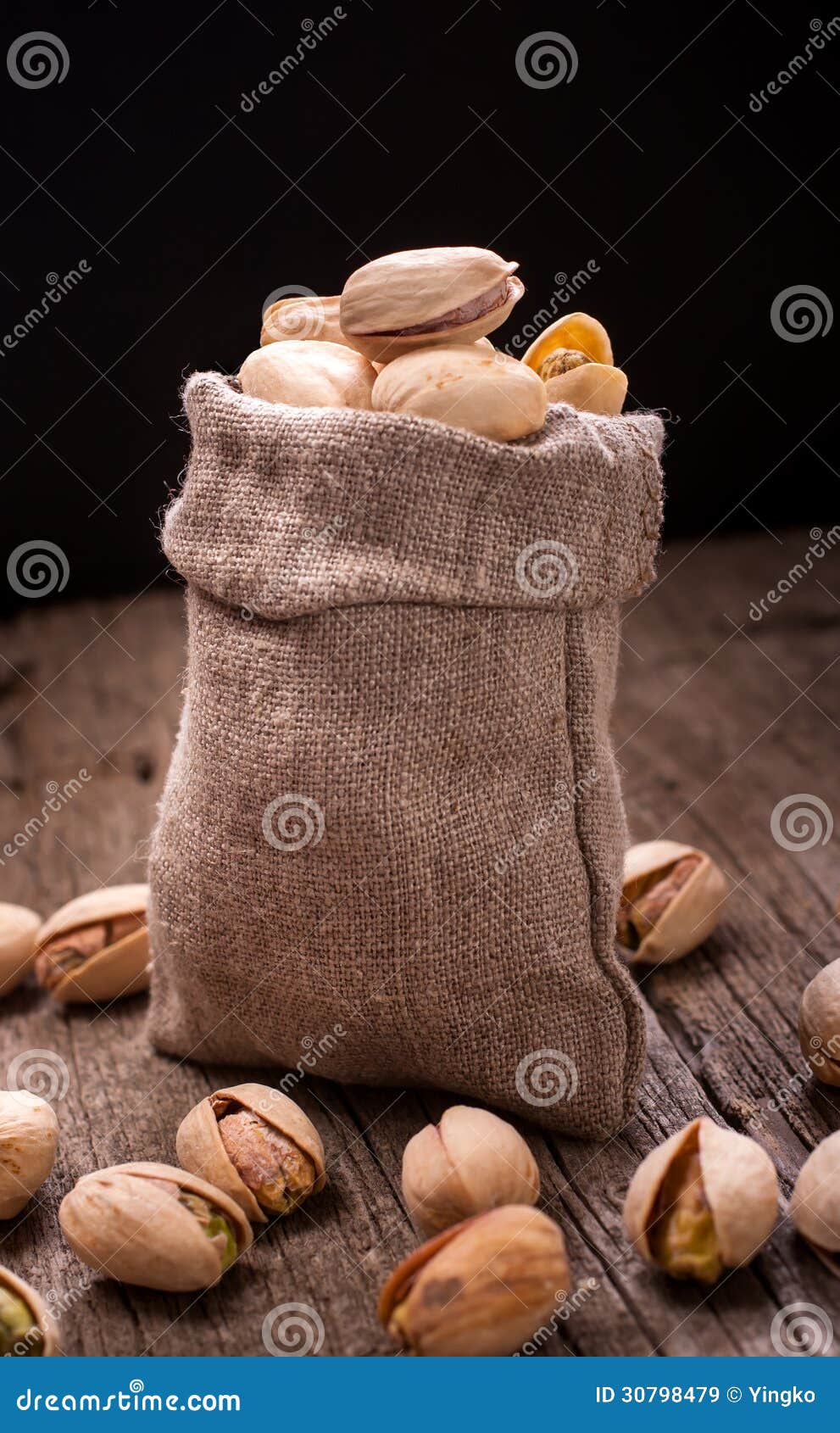 Bag of pistachios on dark stock image. Image of group 30798479