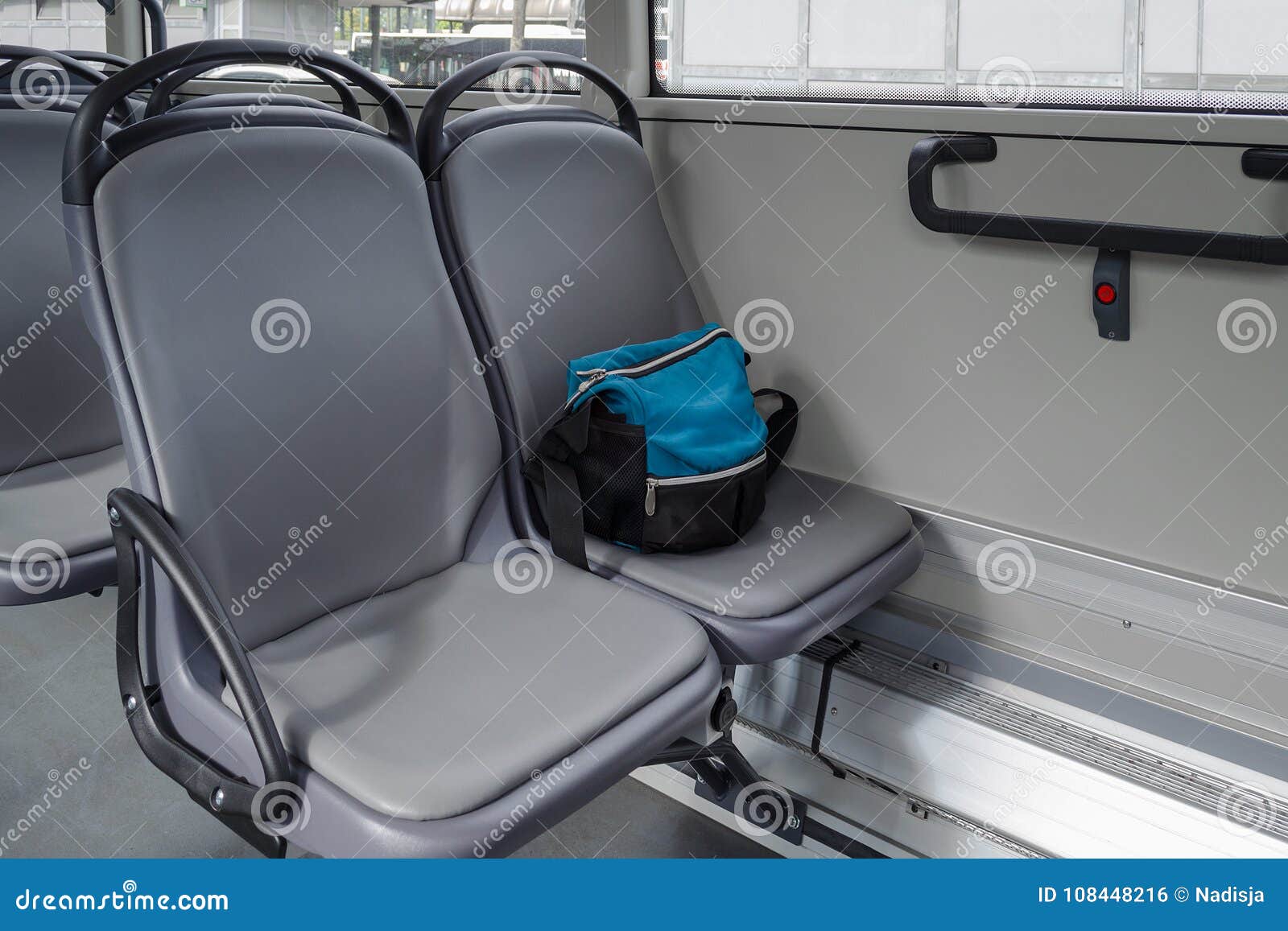 A bag on the seat in bus stock photo. Image of caution 108448216