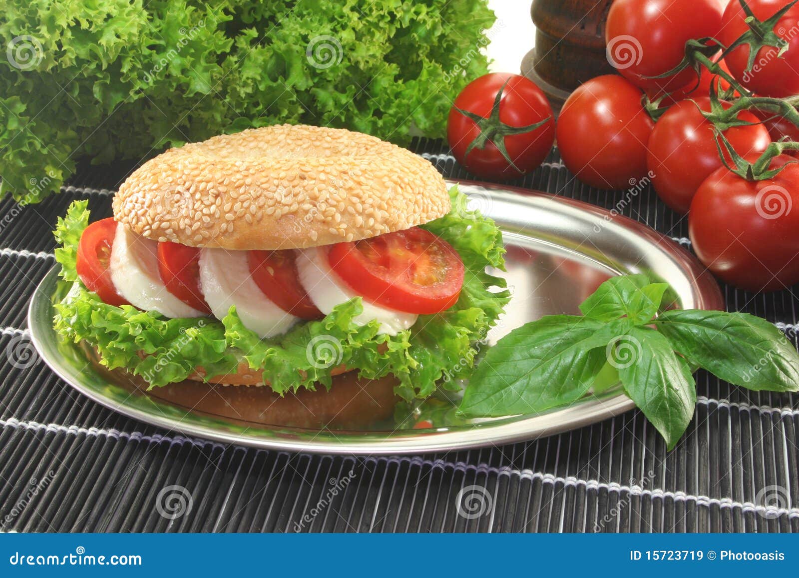 Bagel with Tomato and Mozzarella Stock Image - Image of basil ... Bagel with Tomato and Mozzarella Stock Image - Image of basil ...