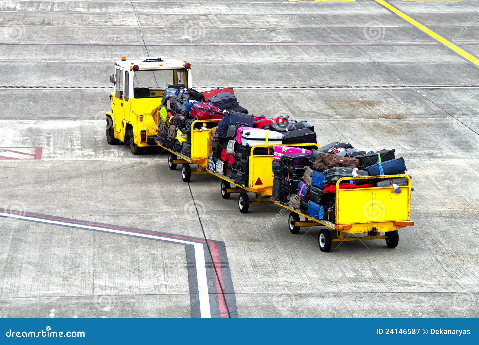 baggage cars at an airport terminal.