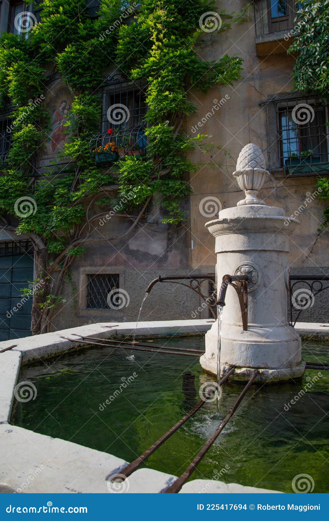 bagolino medieval village, public water fountain in the central square