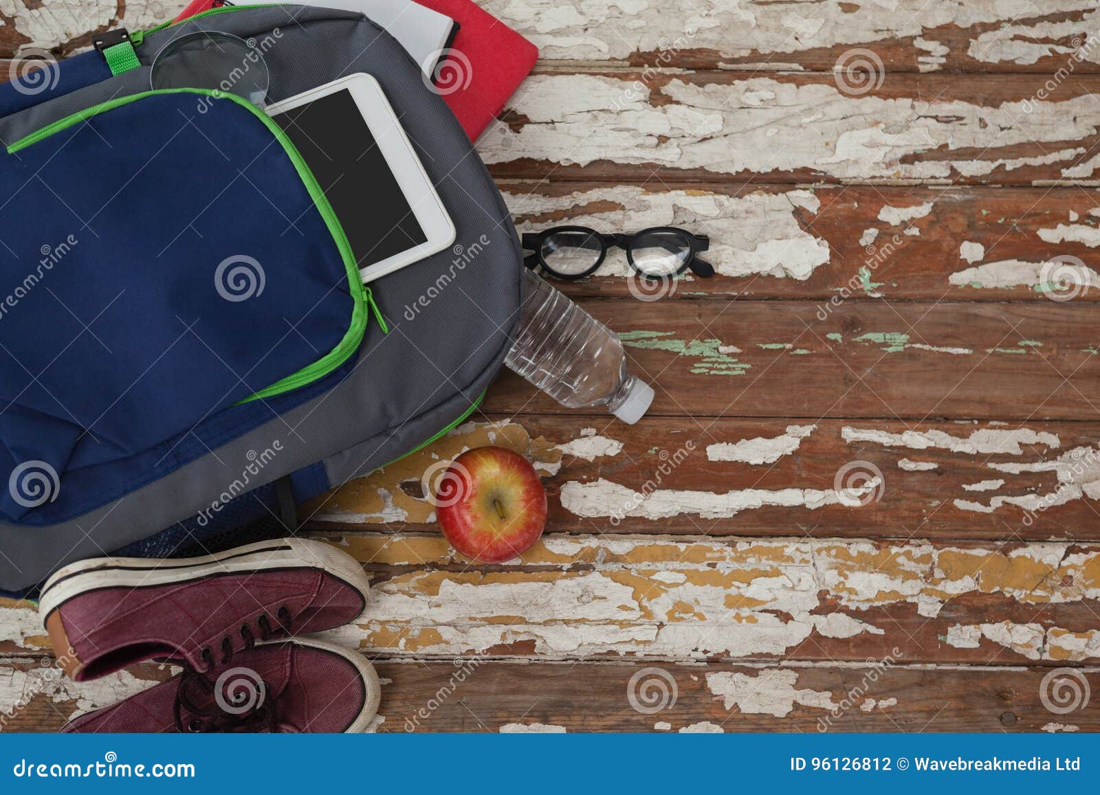 bagpack, water bottle, apple, digital tablet, shoes and spectacle