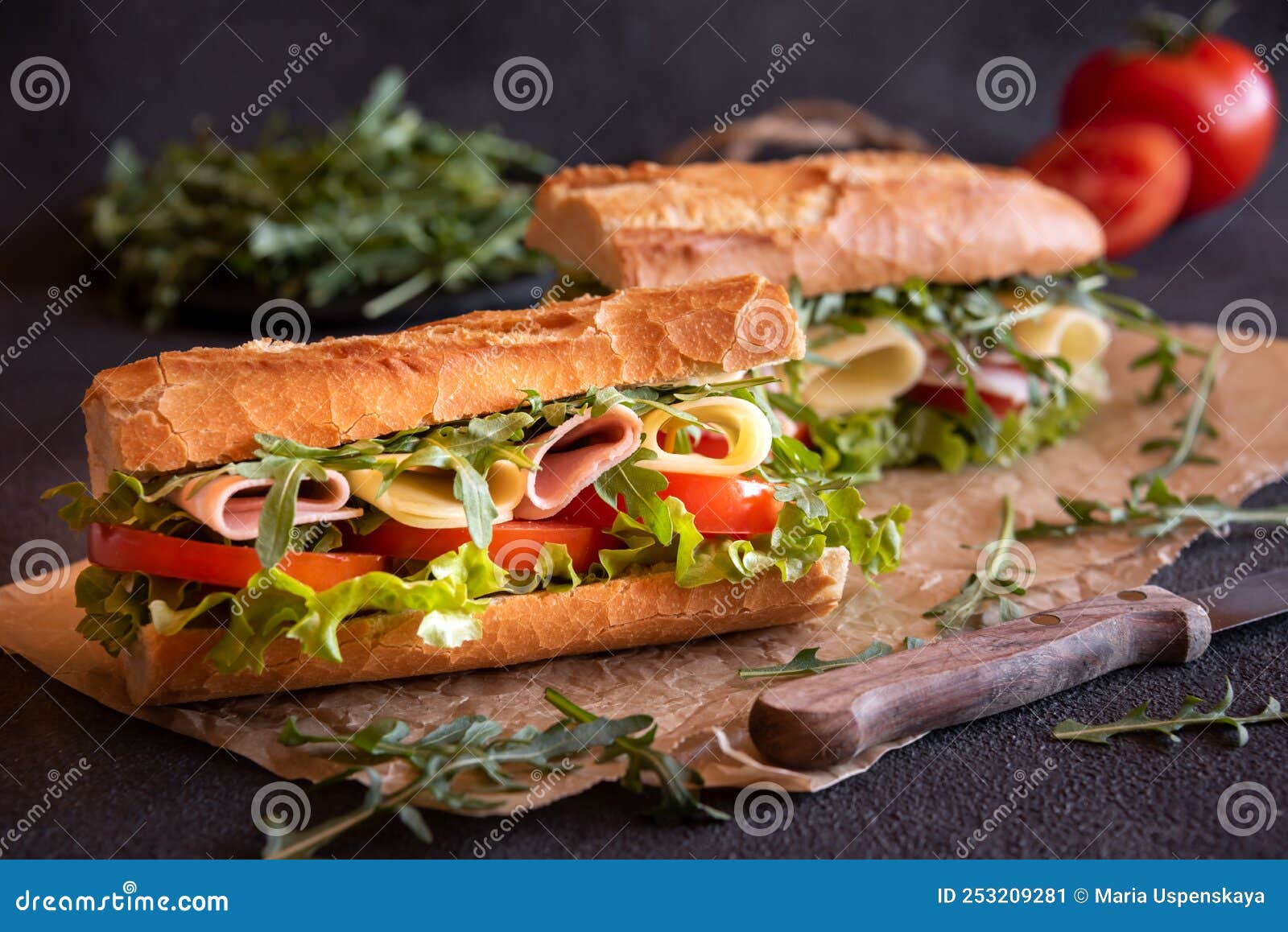 Baguette Sandwich with Cheese, Ham, Tomatoes and Vegetables Stock Image