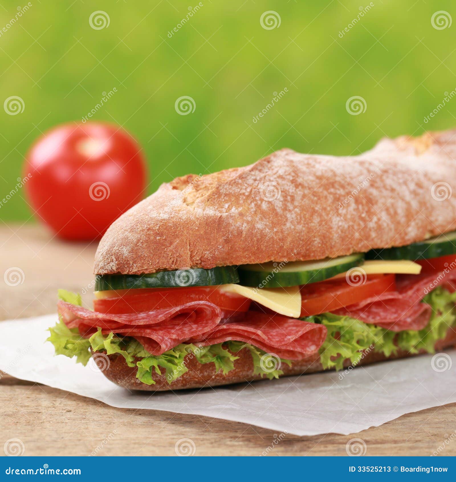 Baguette with Salami Garnished with a Tomato Stock Image Image of
